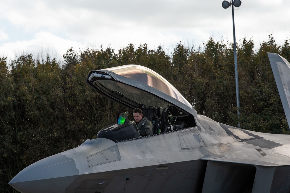 U.S. Air Force F-22 Raptors from the 90th Expeditionary Fighter Squadron integrate with the Royal Netherlands Air Force at Leeuwarden Air Base, Netherlands