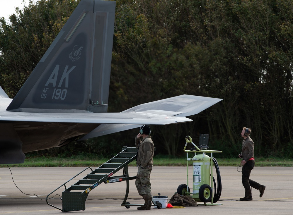 U.S. Air Force F-22 Raptors from the 90th Expeditionary Fighter Squadron integrate with the Royal Netherlands Air Force at Leeuwarden Air Base, Netherlands