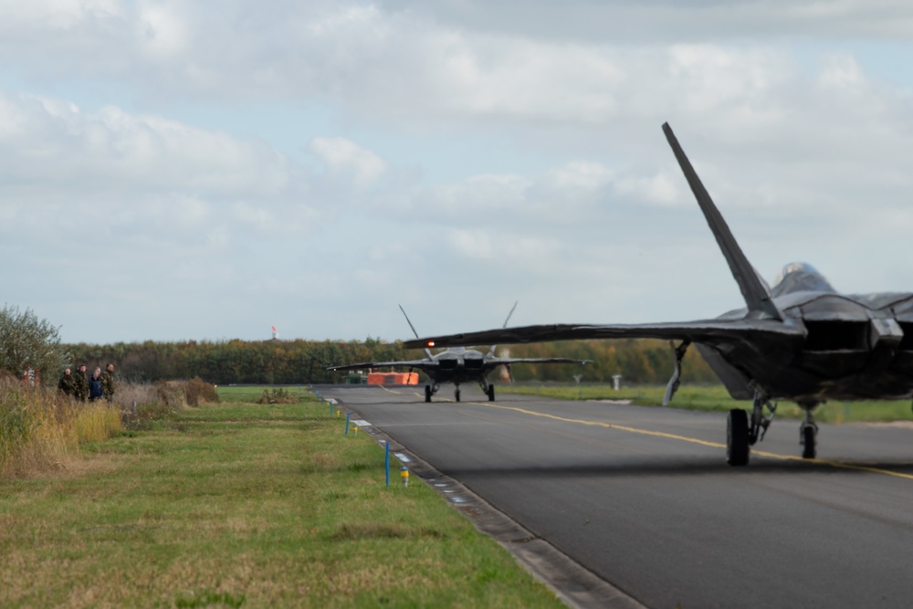 U.S. Air Force F-22 Raptors from the 90th Expeditionary Fighter Squadron integrate with the Royal Netherlands Air Force at Leeuwarden Air Base, Netherlands