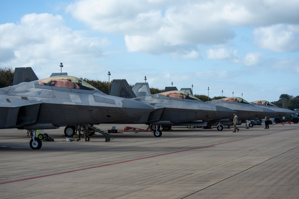 U.S. Air Force F-22 Raptors from the 90th Expeditionary Fighter Squadron integrate with the Royal Netherlands Air Force at Leeuwarden Air Base, Netherlands