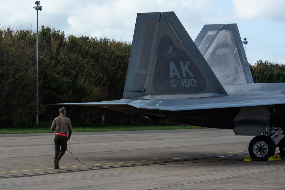 U.S. Air Force F-22 Raptors from the 90th Expeditionary Fighter Squadron integrate with the Royal Netherlands Air Force at Leeuwarden Air Base, Netherlands