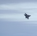 F-22s and HH-60Gs fly over JBER