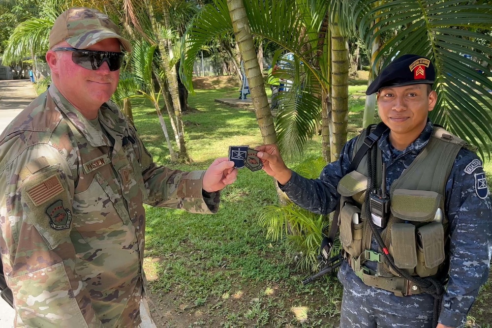 Arkansas and Guatemalan armed forces swap unit patches during Continuing Promise 2022