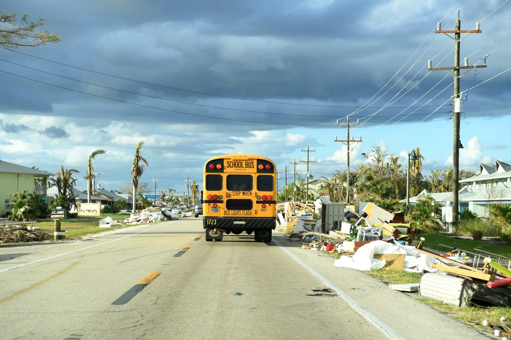 School Buses Transport Students To and From School in Neighborhoods Impacted by Hurricane Ian