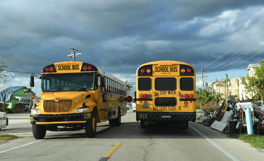 School Buses Transport Students To and From School in Neighborhoods Impacted by Hurricane Ian