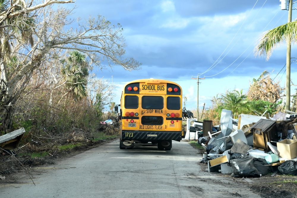 School Buses Transport Students To and From School in Neighborhoods Impacted by Hurricane Ian