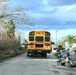 School Buses Transport Students To and From School in Neighborhoods Impacted by Hurricane Ian