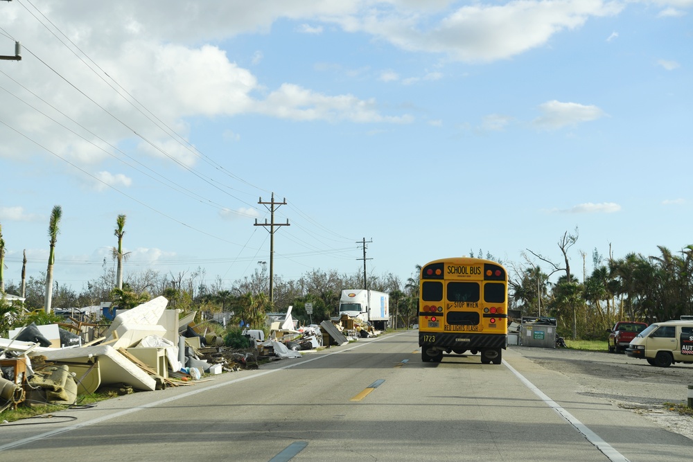 School Buses Transport Students To and From School in Neighborhoods Impacted by Hurricane Ian