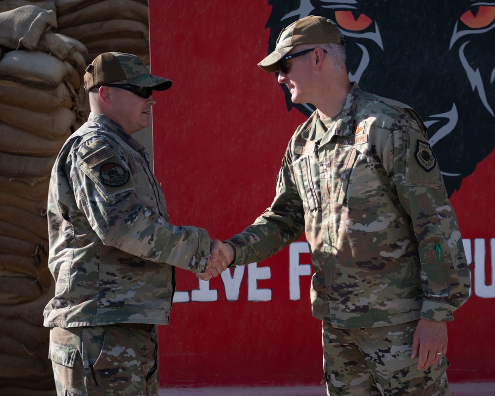 Tech. Sgt. Cory Williams coined by 332d Air Expeditionary Wing Commander Brig. Gen. Ryan R. Messer