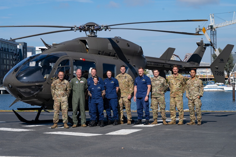 Coast Guard members pose for a group photo with members from the Air Force and Army California National Guard