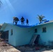 Crews Work To Install Blue Roofs as Part of the Army Corps of Engineers Operation Blue Roof