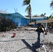 Crews Work To Install Blue Roofs as Part of the Army Corps of Engineers Operation Blue Roof