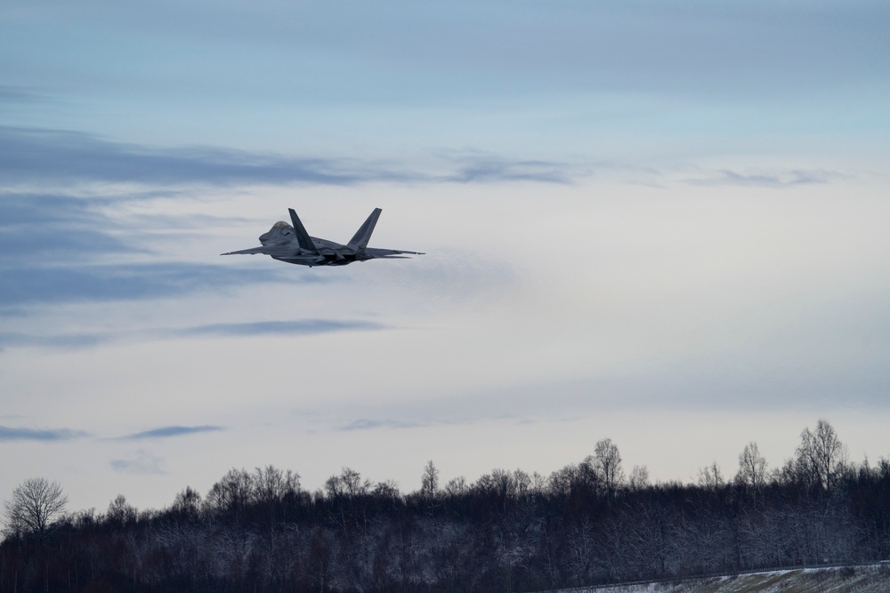 F-22s fly over JBER