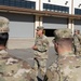 Soldiers get coins from 1st Signal Brigade command team