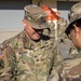 Soldiers get coins from 1st Signal Brigade command team