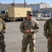 Soldiers get coins from 1st Signal Brigade command team