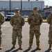 Soldiers get coins from 1st Signal Brigade command team