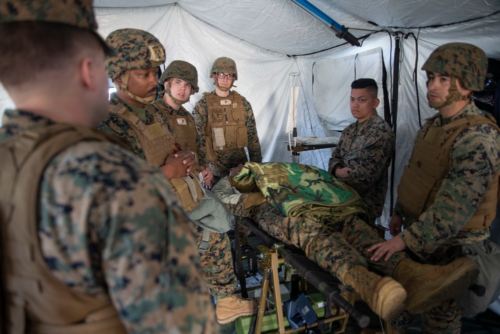 MAG-12 Navy Corpsmen hone their skills during a flight line aid station exercise