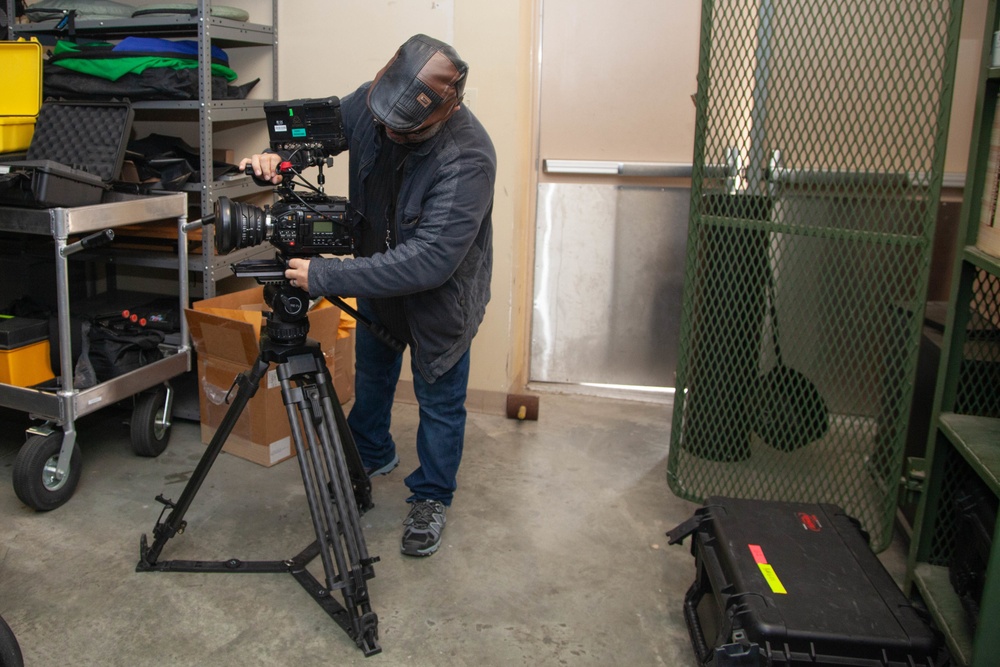 Camera Man Preps Equipment for Military Spirit Week