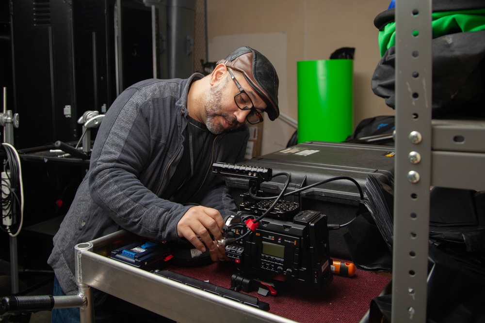 Camera Man Preps Equipment for Military Spirit Week