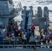 USS Ronald Reagan (CVN 76) conducts a fueling-at-sea with the Arleigh Burke-class guided-missile destroyer USS Higgins (DDG 76)
