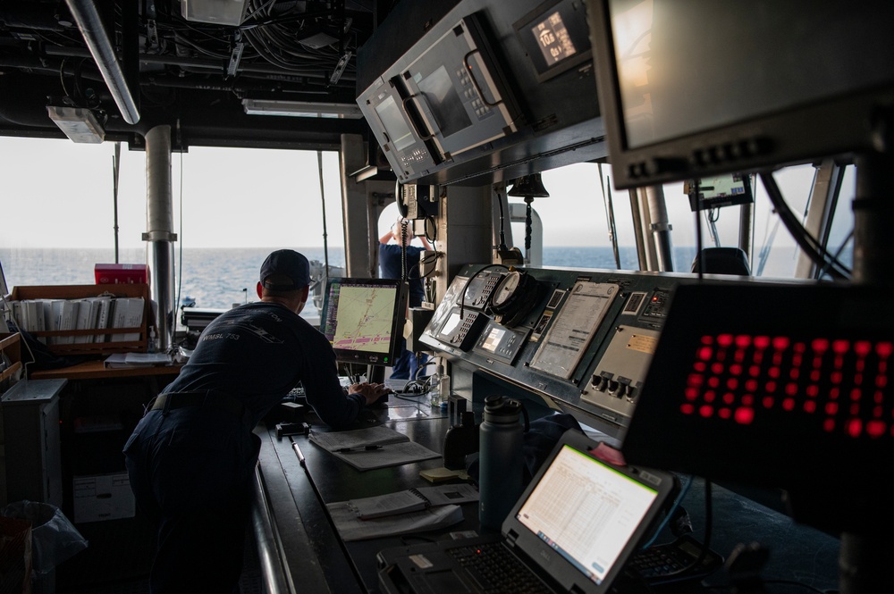 Coast Guard Cutter Hamilton crewmembers navigate from the bridge while underway in the English Channel