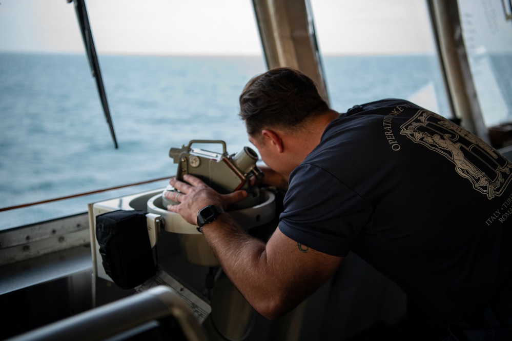 Coast Guard Cutter Hamilton crewmembers navigate from the bridge while underway in the English Channel