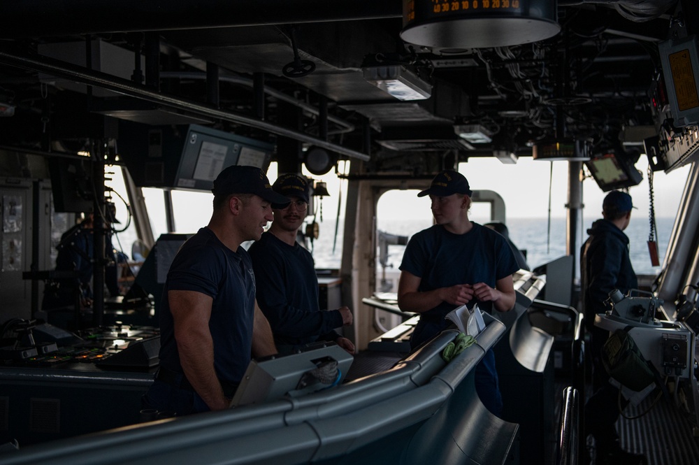 Coast Guard Cutter Hamilton crewmembers navigate from the bridge while underway in the English Channel