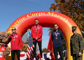 King wins Marine Corps/Armed Forces Marathon; Navy women sweep podium