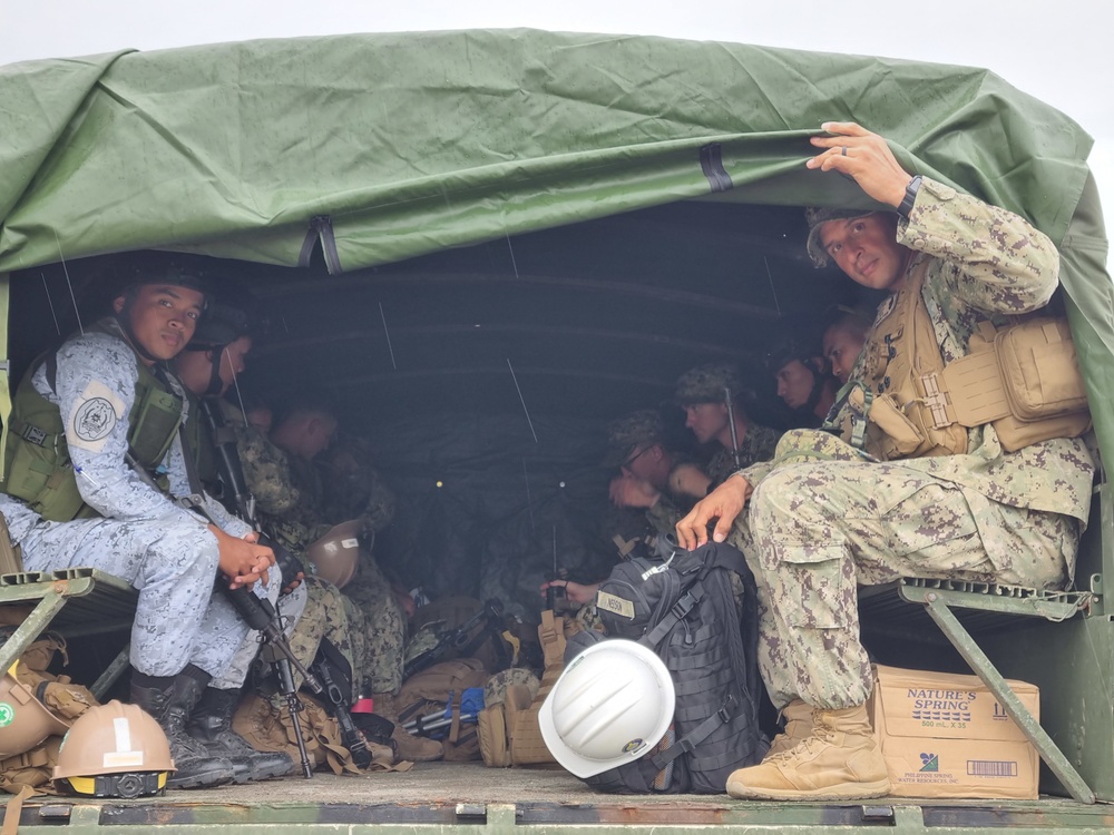 Senior Chief Utilitiesman Darryn Nelson and Seabees with Naval Construction Battalion (NMCB) 4, Leads seabees into the field during The Kamandag Exercise