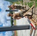 Utiliesman 2nd Class Jonathan Dunn and Construction Mechanic 3rd Class Christian Parker with Naval Mobile Construction Battalion (NMCB 4), preparing columns for concrete pour.