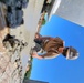 Utiliesman 2nd Class Joane Duran, spreads concrete that will ultimately support the wall panel.