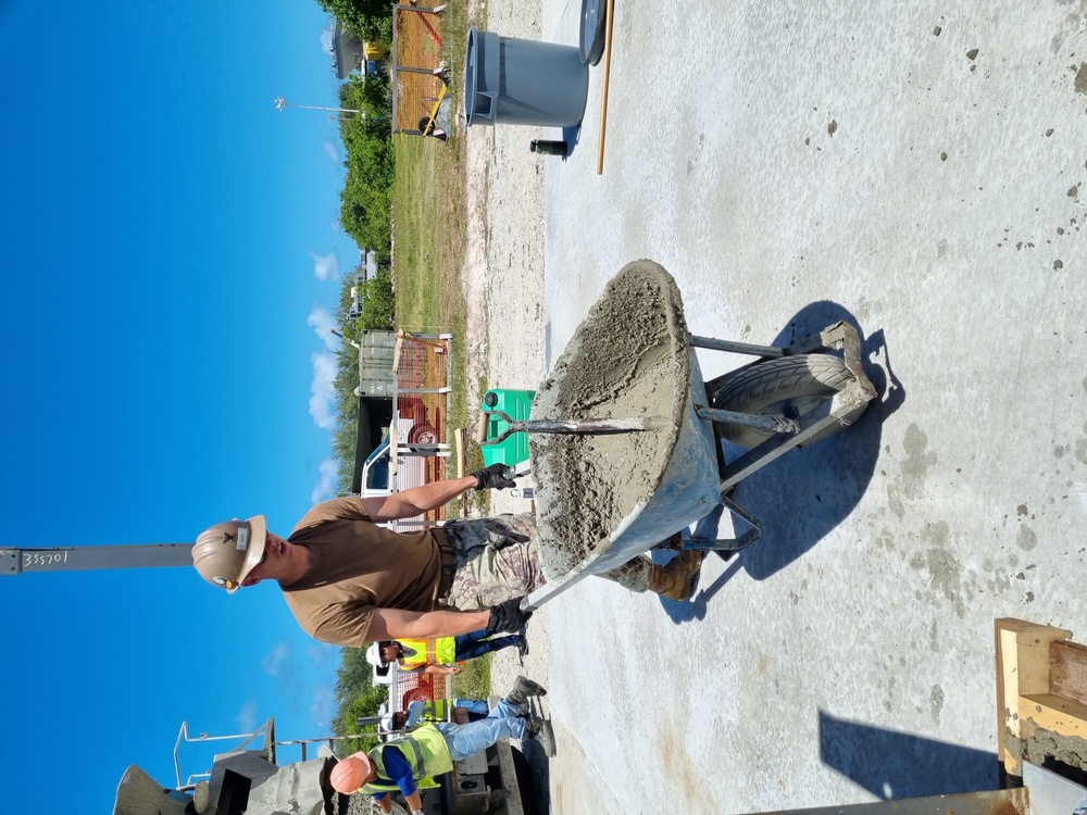 Utiliesman 2nd Class Jonathan Dunn,  works with KBR contractors by transporting concrete.