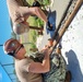 Construction Mechanic 3rd Class Christian Parker trains Mass Communication Specialist Marron.