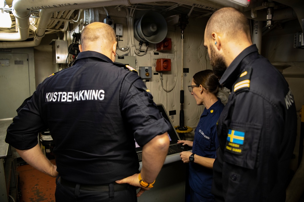 U.S. Coast Guard Cutter Hamilton welcomes aboard members of the Swedish Coast Guard while underway in the Baltic Sea