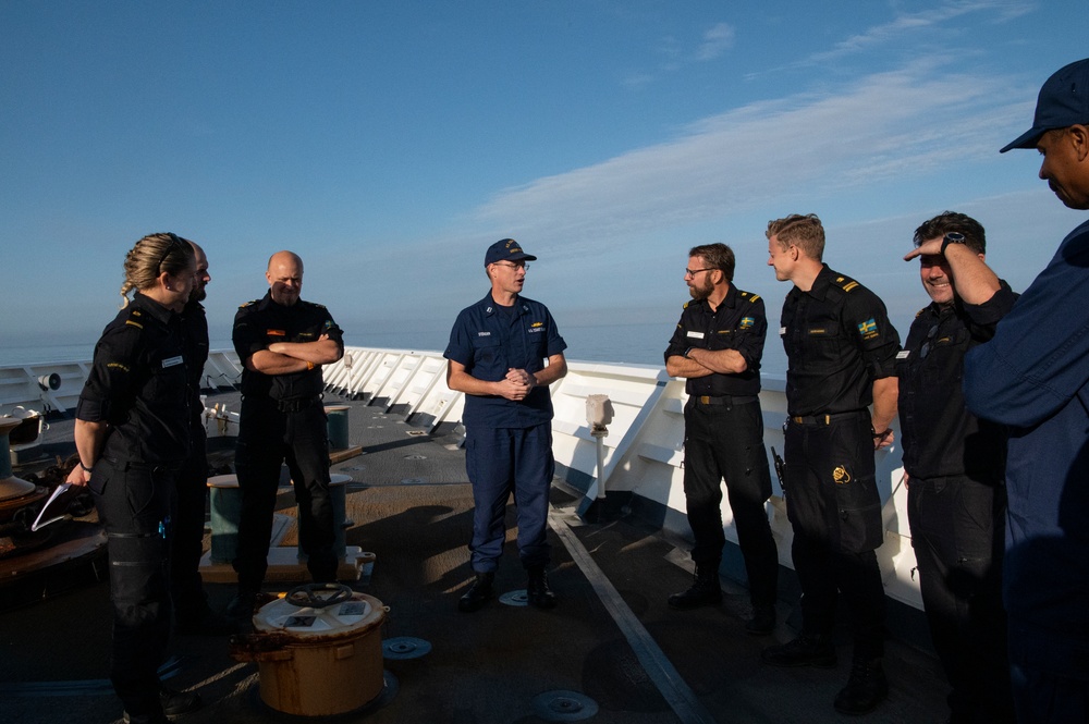 U.S. Coast Guard Cutter Hamilton welcomes aboard members of the Swedish Coast Guard while underway in the Baltic Sea