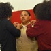 Chief Personnel Specialist Danielle Bradby, assigned to Naval Air Station (NAS) Joint Reserve Base (JRB) Fort Worth, is pinned by her family during a chief petty officer pinning ceremony