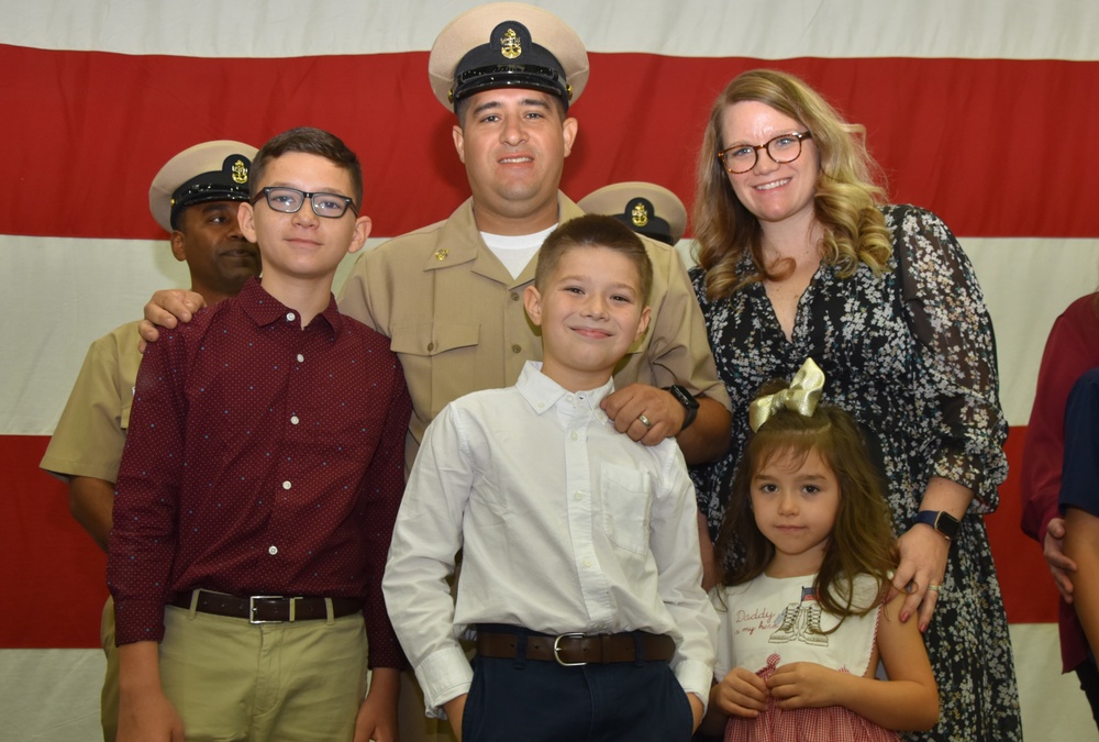 Chief Air Traffic Controlman Mark Flores, assigned to Naval Air Station (NAS) Joint Reserve Base (JRB) Fort Worth, was pinned by his family during a chief petty officer pinning ceremony