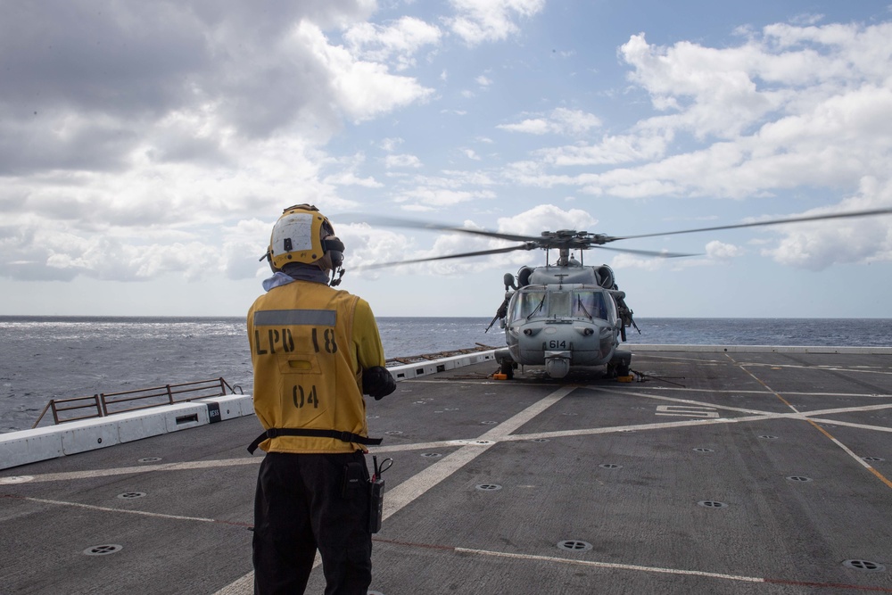 HSC-21 Helicopter Lands on USS New Orleans during Operations with USS Ronald Reagan in the Philippine Sea