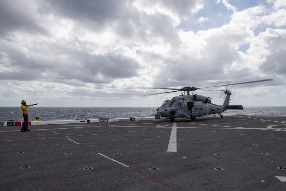 HSC-21 Helicopter Lands on USS New Orleans during Operations with USS Ronald Reagan in the Philippine Sea