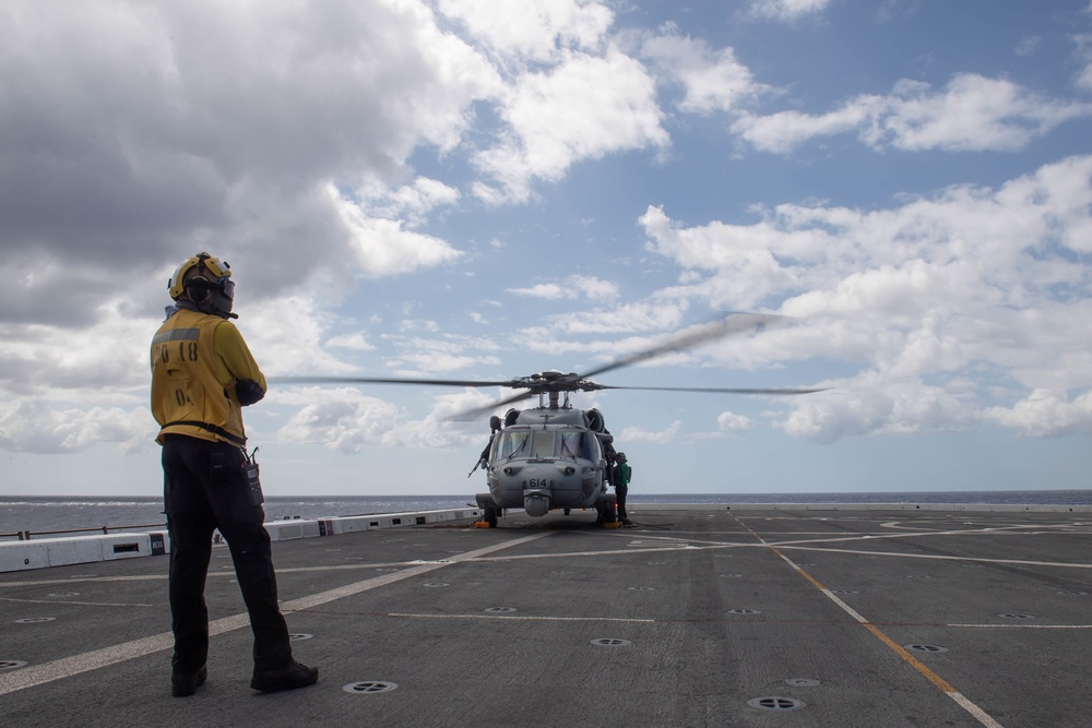 HSC-21 Helicopter Lands on USS New Orleans during Operations with USS Ronald Reagan in the Philippine Sea