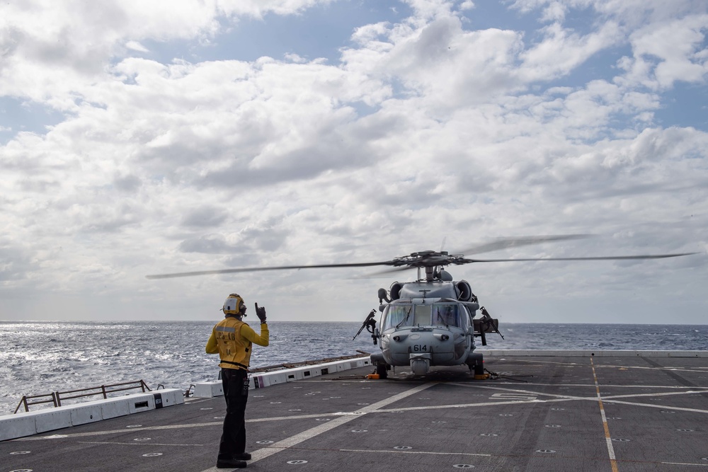 HSC-21 Helicopter Lands on USS New Orleans during Operations with USS Ronald Reagan in the Philippine Sea