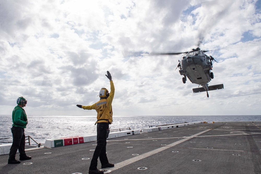 HSC-21 Helicopter Lands on USS New Orleans during Operations with USS Ronald Reagan in the Philippine Sea