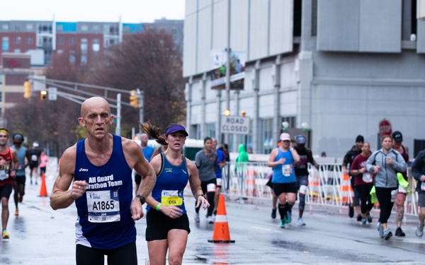 Indiana National Guard marathon team run alongside national team