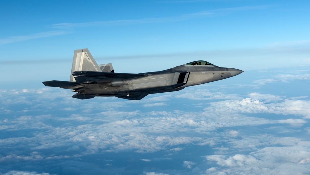 KC-135 refuels F-22s during Air Shielding