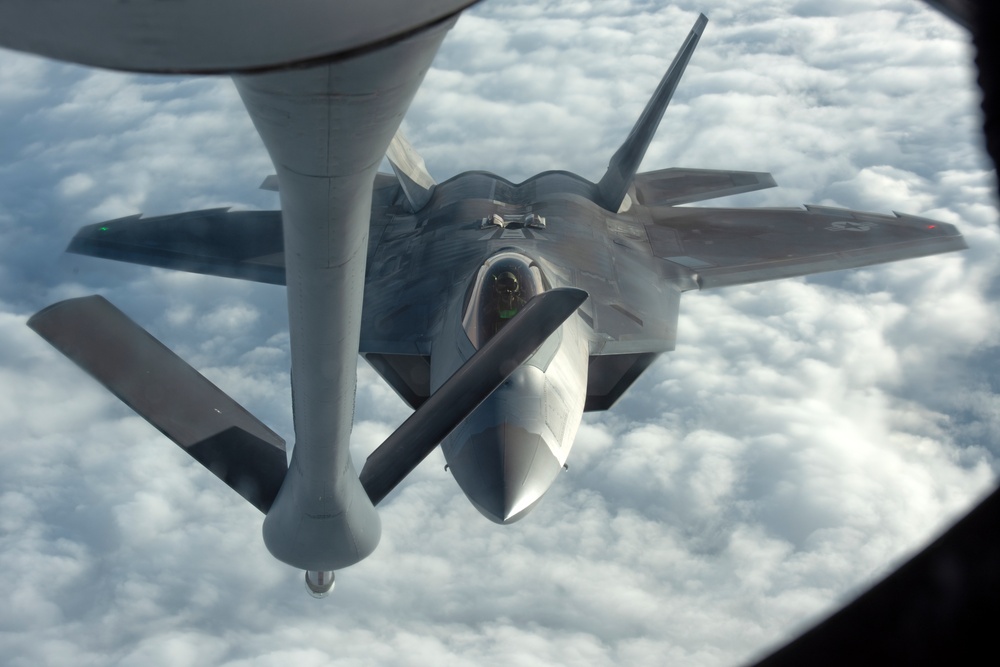 KC-135 refuels F-22s during Air Shielding