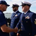 U.S. Coast Guard Chief Machinery Technician Richard Gauthier and Chief Culinary Specialist Tristen Davis receive the permanent cutter man insignia.