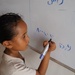 A girl student learns to write in Yemen