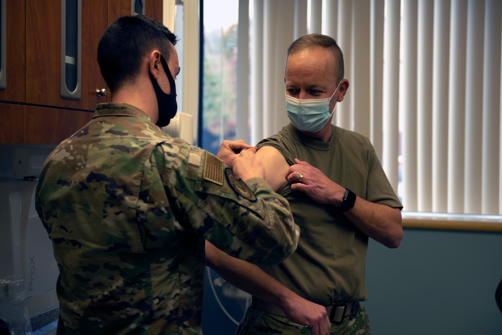 60th AMW commander rolls up sleeve for flu shot