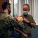 60th AMW commander rolls up sleeve for flu shot